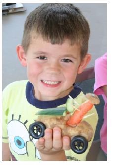 Boy with vegetable car - rock-ranch-heritage