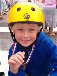 Boy competing at Twilight bike race